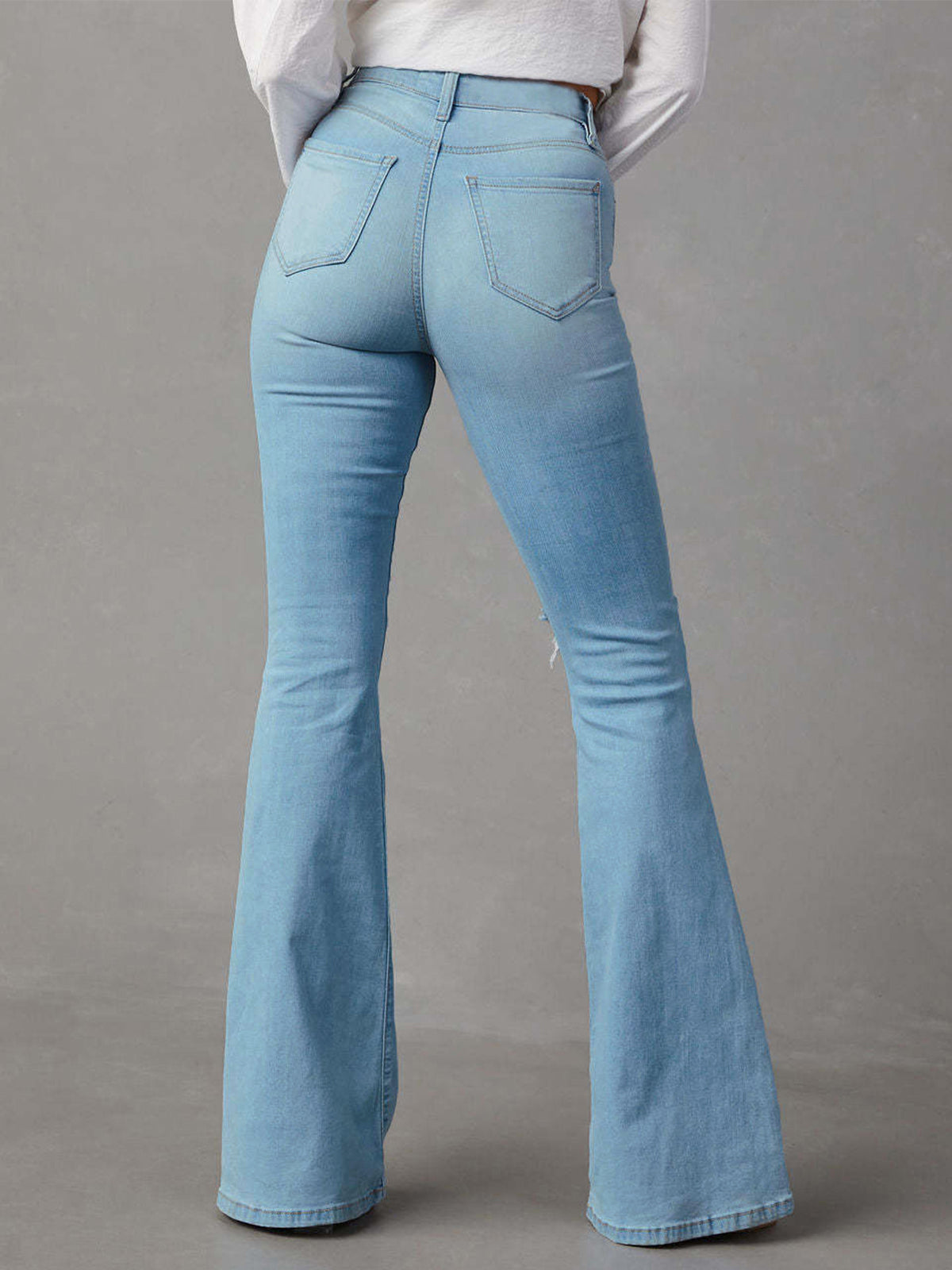 Slitna denim utsvängda jeans
