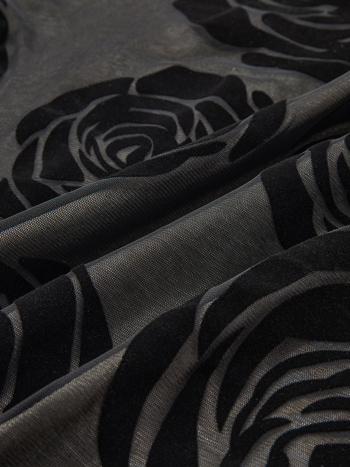 Asymmetrisk långklänning med jacquardmönster och blommönster