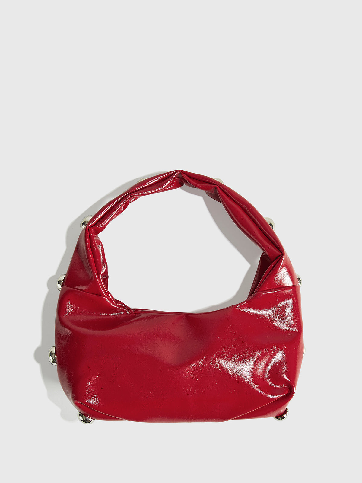 Abgerundete Achseltasche mit Nieten