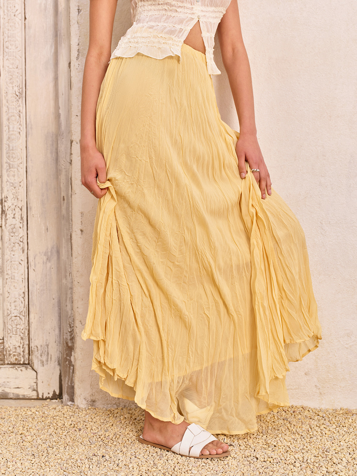 Faltenrock mit hoher Taille und asymmetrischem Saum