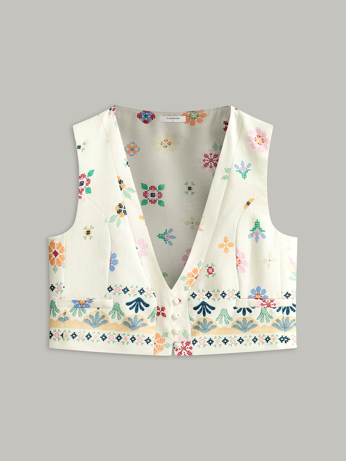 Blommig väst med broderad knappdetalj