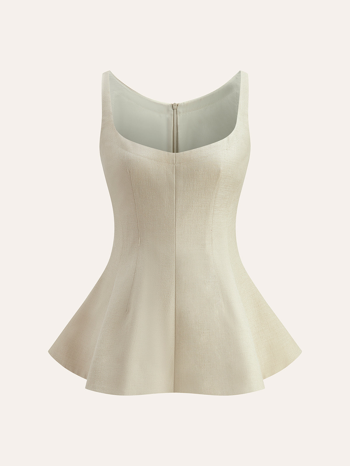 Topp med dragkedja baktill och utsvängd peplum 