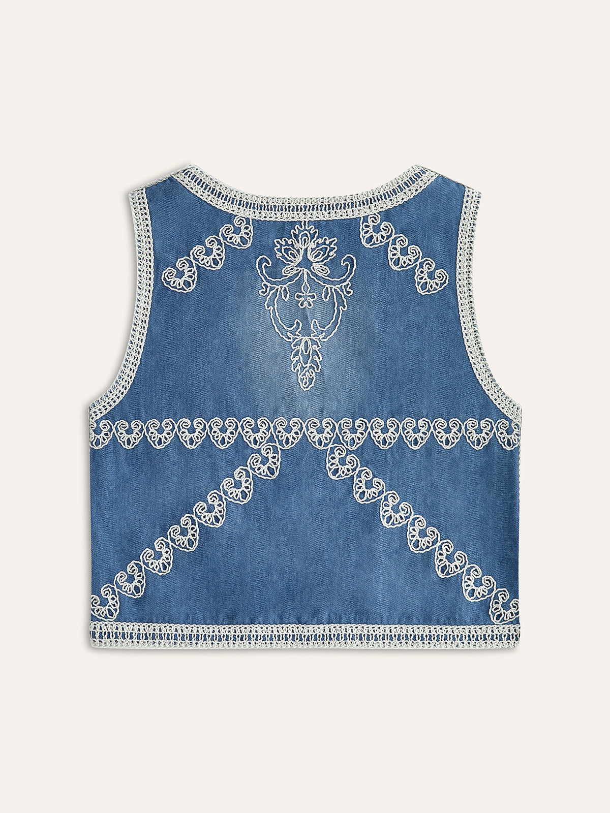 Broderad väst i denim med knappar 