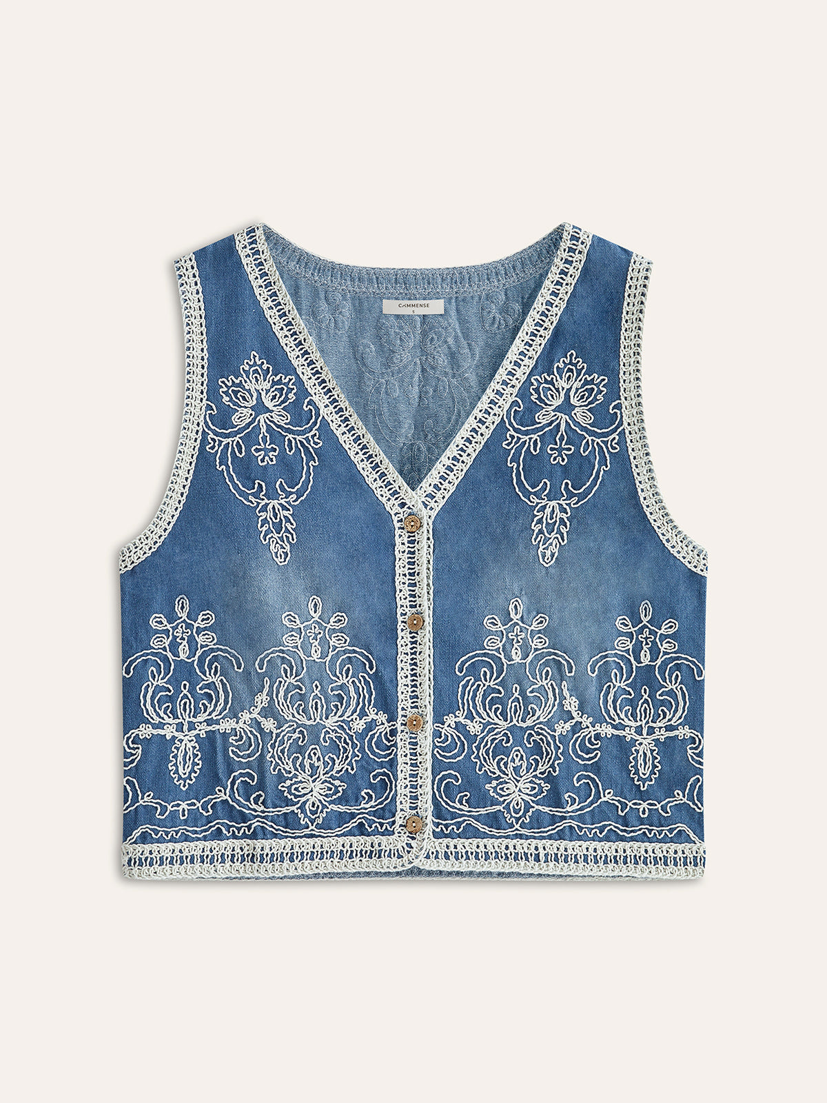Broderad väst i denim med knappar 