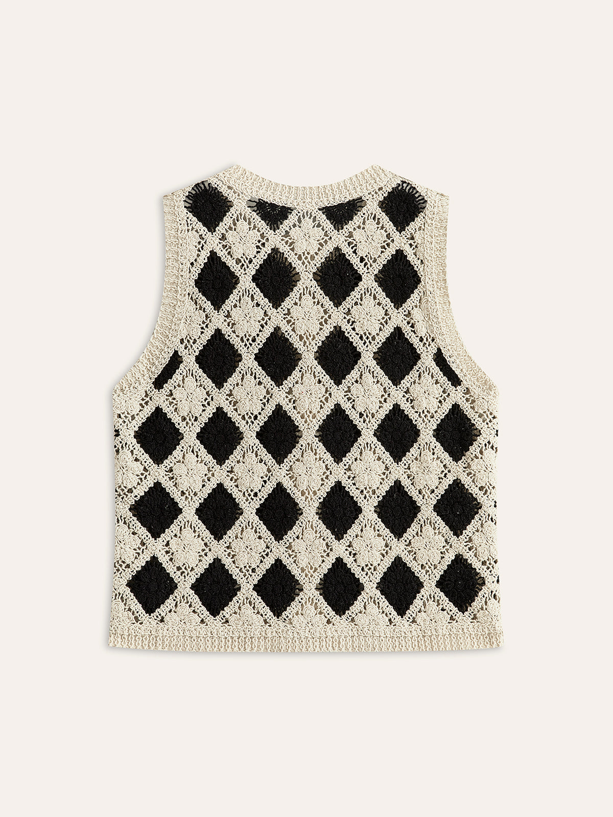 Stickad väst med broderat diamantmönster