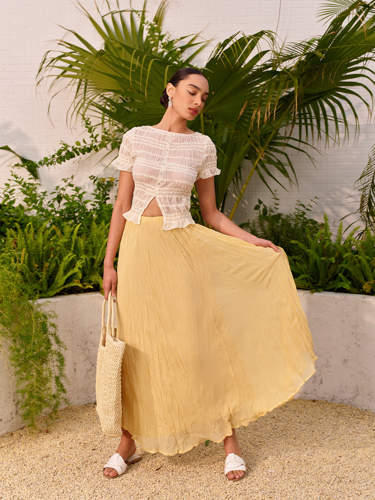 Faltenrock mit hoher Taille und asymmetrischem Saum 
